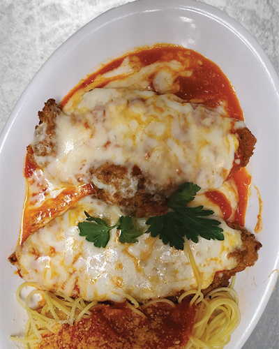 A hot chicken parmesan with melted cheese