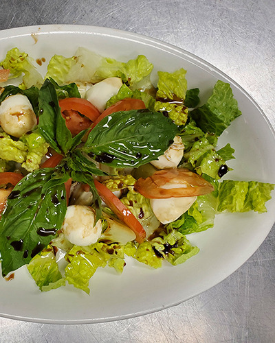 A salad slathered in dressing